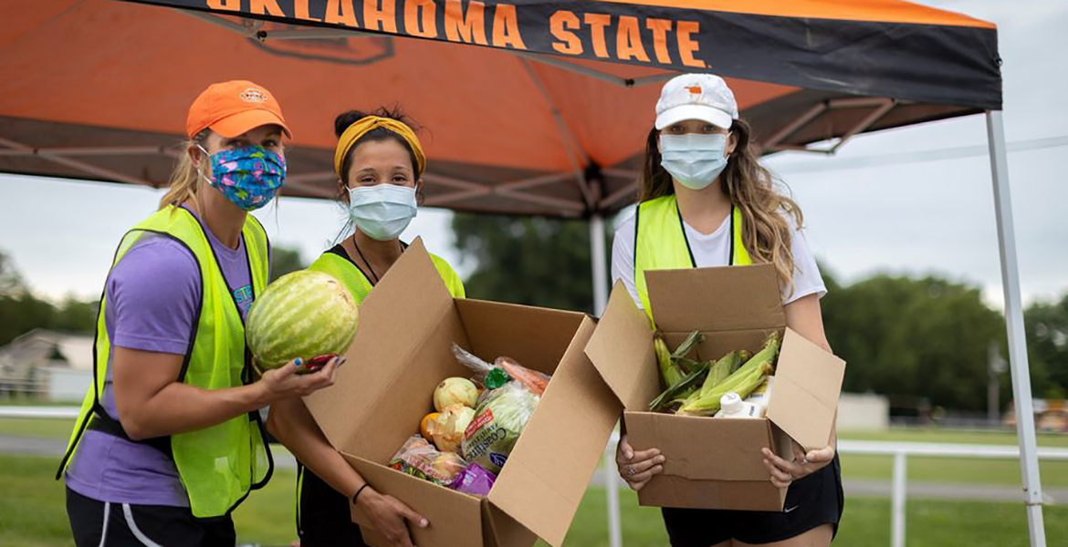 Students working at a food distribution event