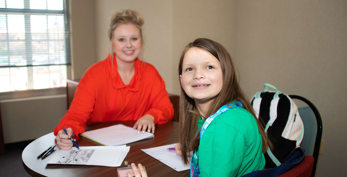 student teacher tutoring child