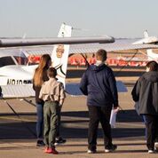 Aviation student working with boy scouts