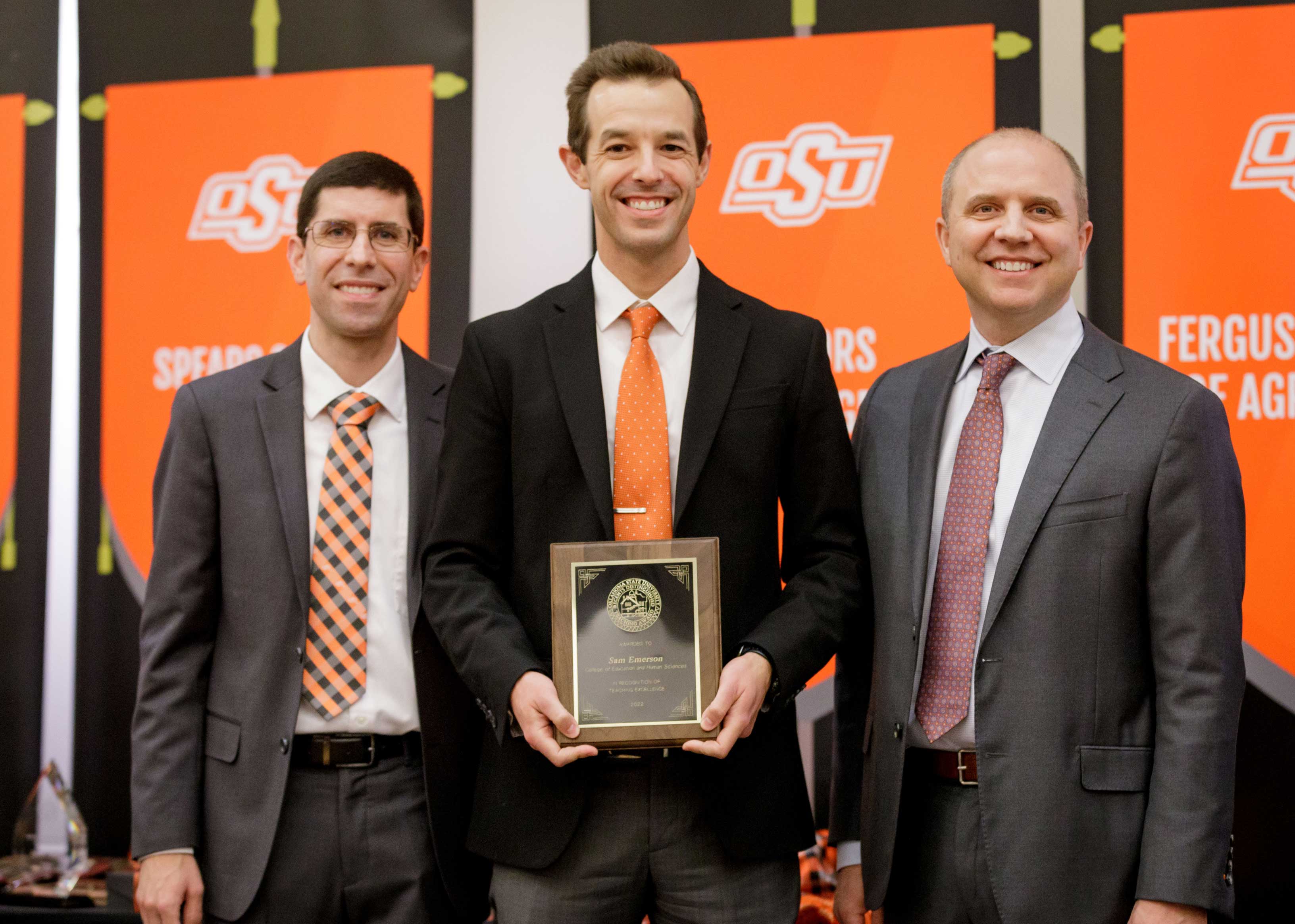 Dr. Sam Emerson receives award.