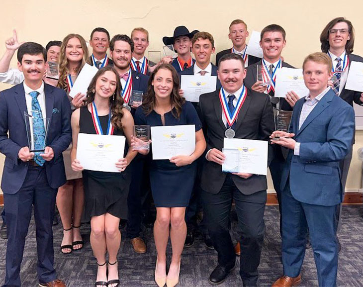 Flight Team poses with their award certificates