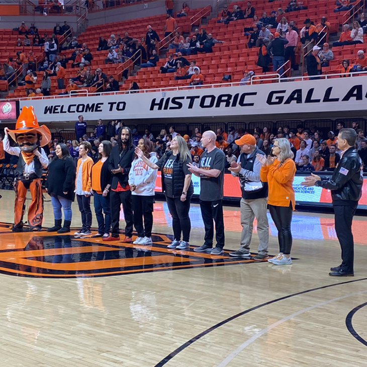 Heal Orange honorees on court at Gallagher-Iba Arena