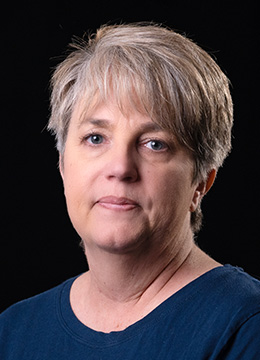A professional headshot of Heather Pidcock