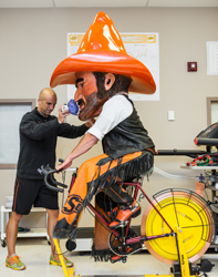 Pistol Pete rides and exercise bike.