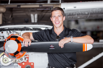 Alum Jared Jacobs with a plane