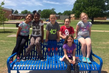 Group of students on a bench