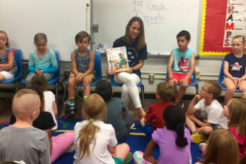 Sarah Kirk reading to a class