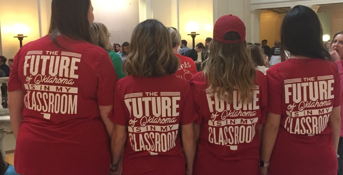 Group of teachers with tshirts at the state capital