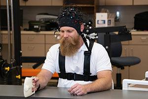 Brain Blast participant with head gear