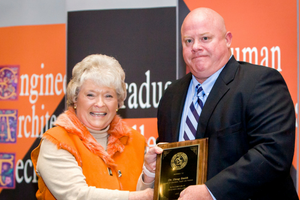 Professor Doug Smith receiving award