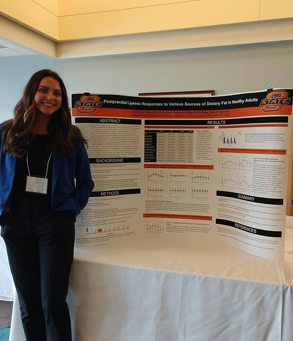 OSU student at research poster