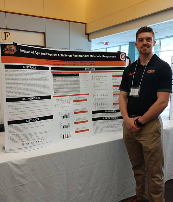 OSU student at research poster