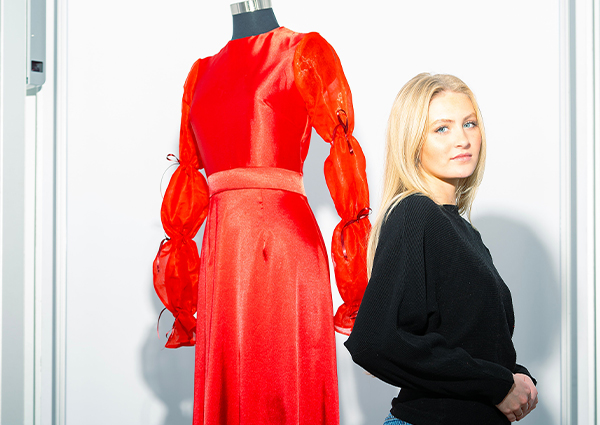 Grace Chapman poses with elegant red dress