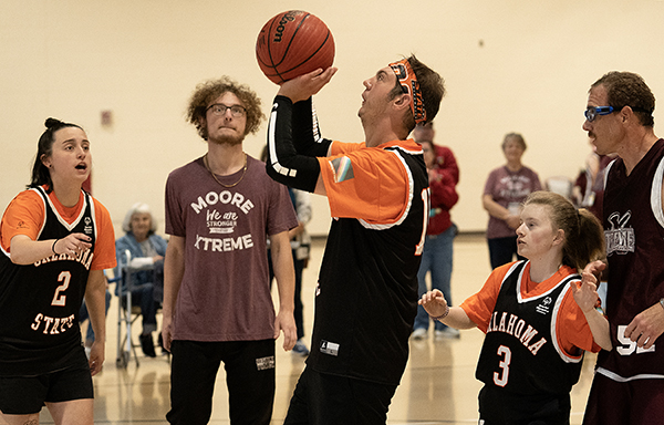 special olympics athlete playing basketball