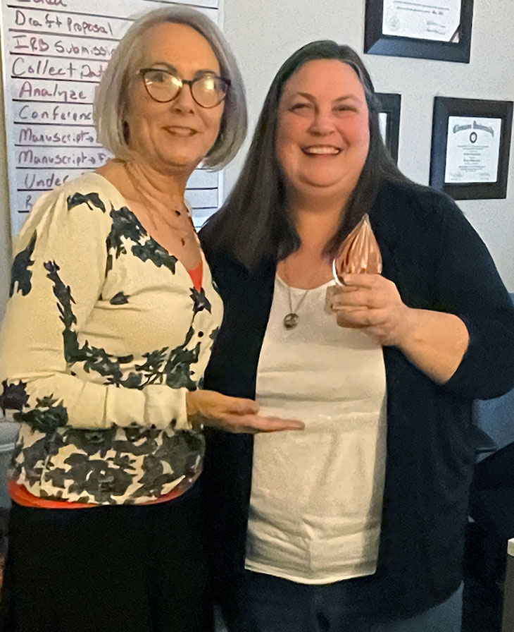 Dr. Jennifer Cribbs is presented with award