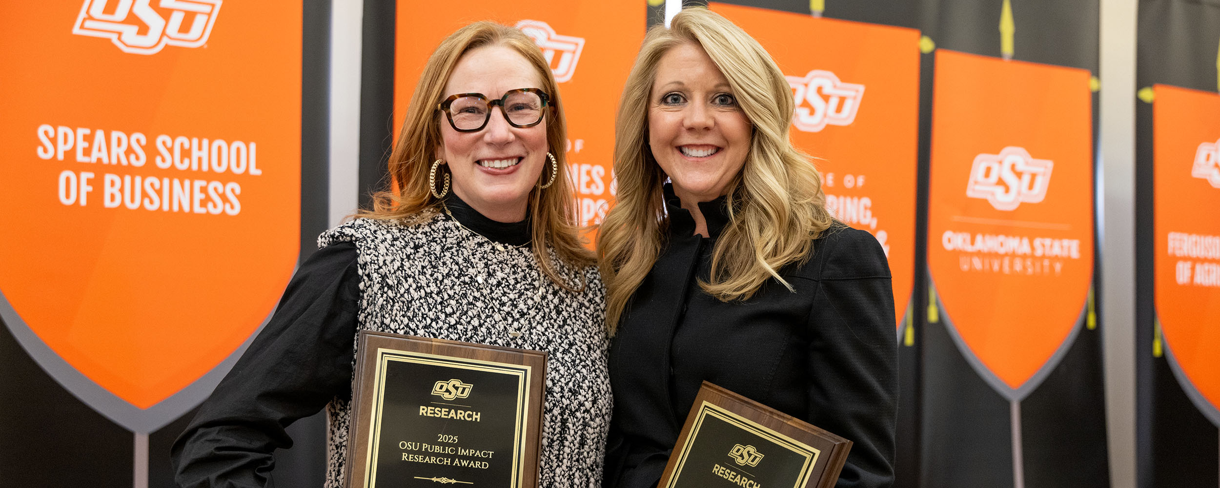 Drs. Jennifer Jones and Kami Gallus holding OSU Public Impact Awards
