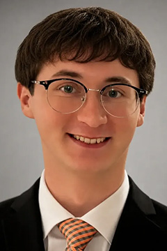 A professional headshot of Conner Brown.