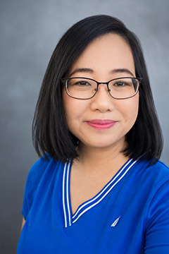 A professional headshot of Grace Tran.
