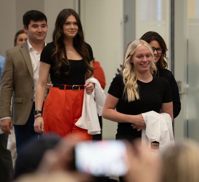 Students walk in for the White Coat Ceremony
