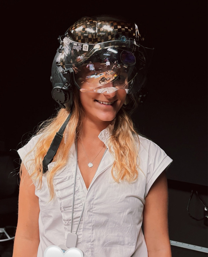 Ainsley Kyle is shown wearing a flight helmet that contians high-end technology.