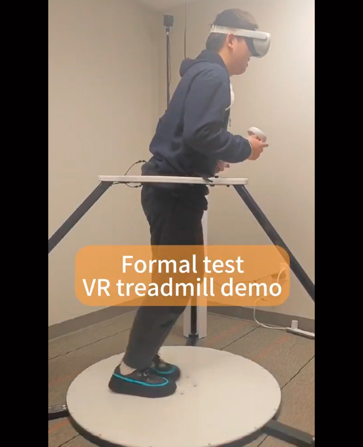 A student wearing a virtual reality headset uses a virtual reality treadmill during a simulation.