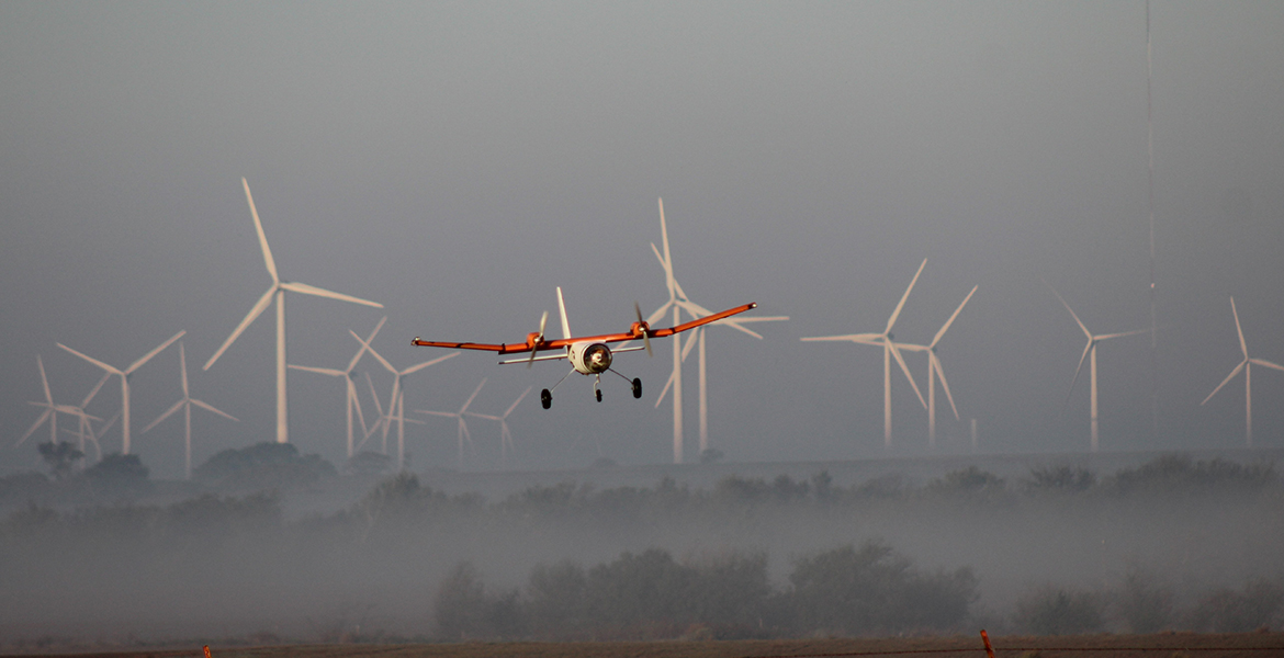 Aircraft flying over field