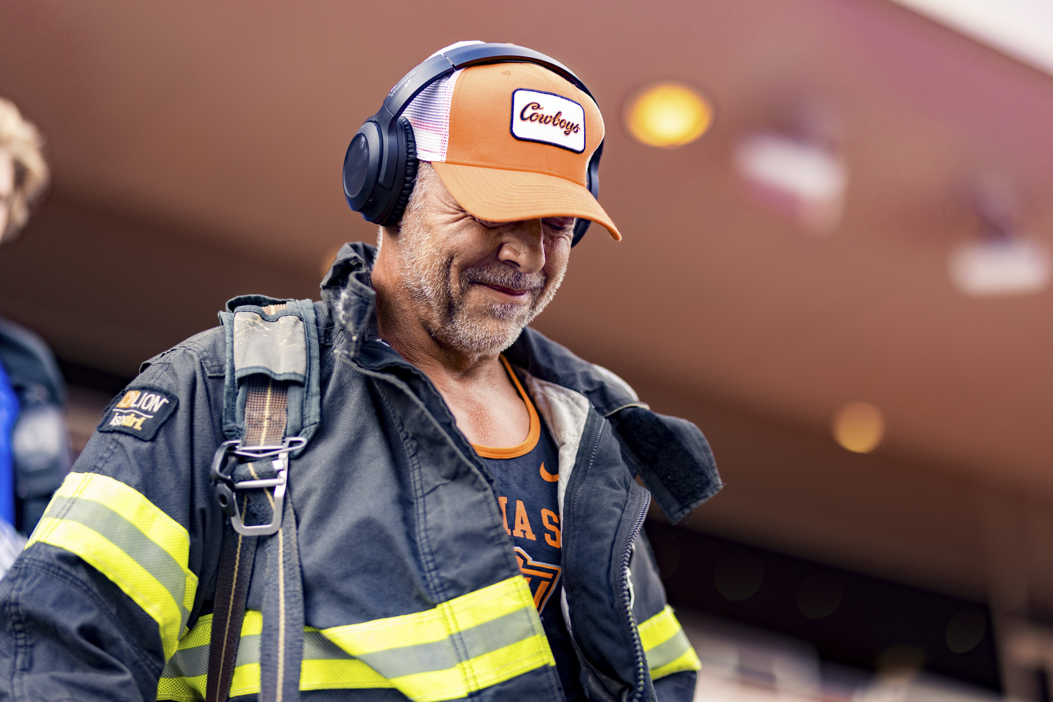 OSU Alumni climbing stairs in bunker gear