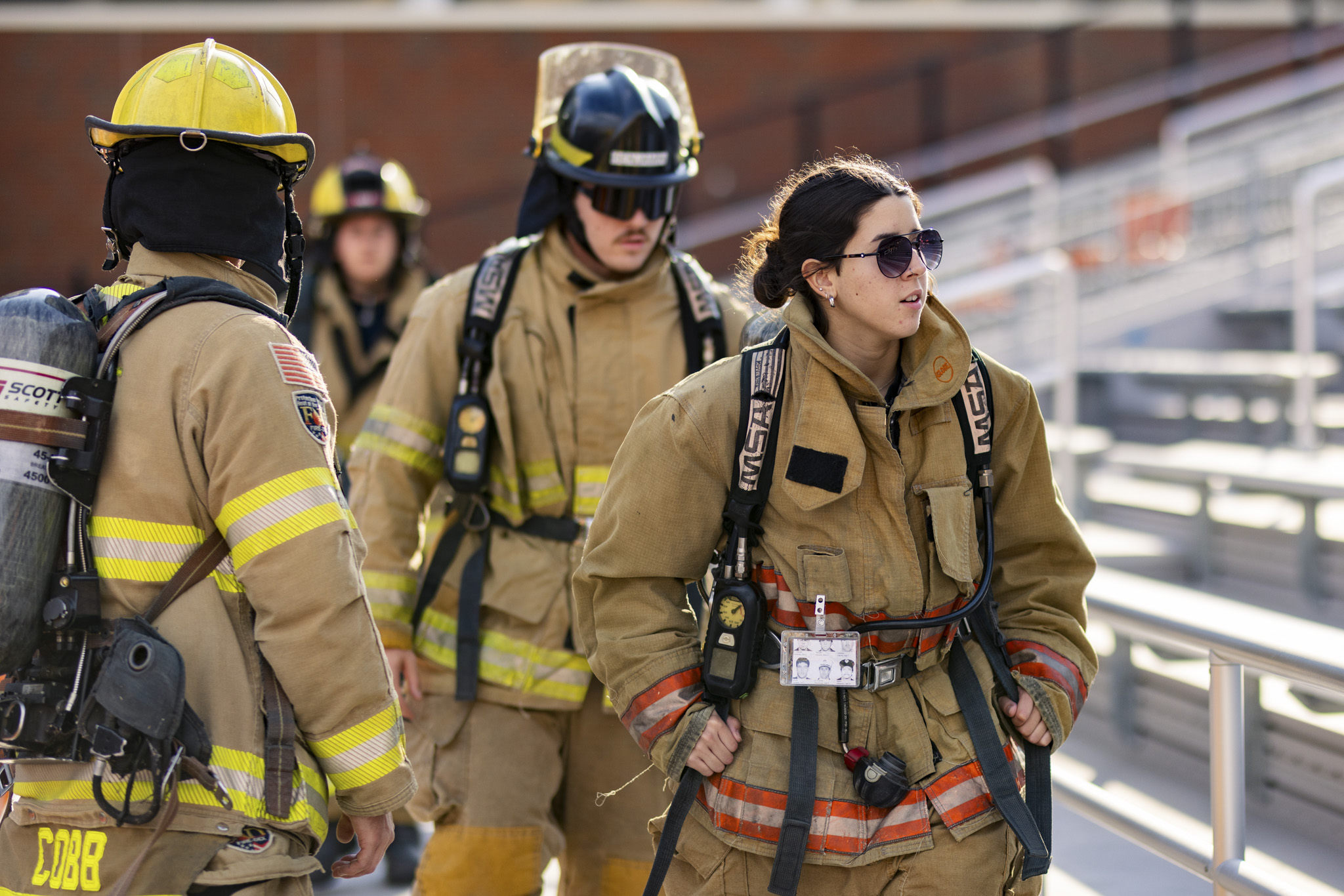 group of three firefighters in bunker gear