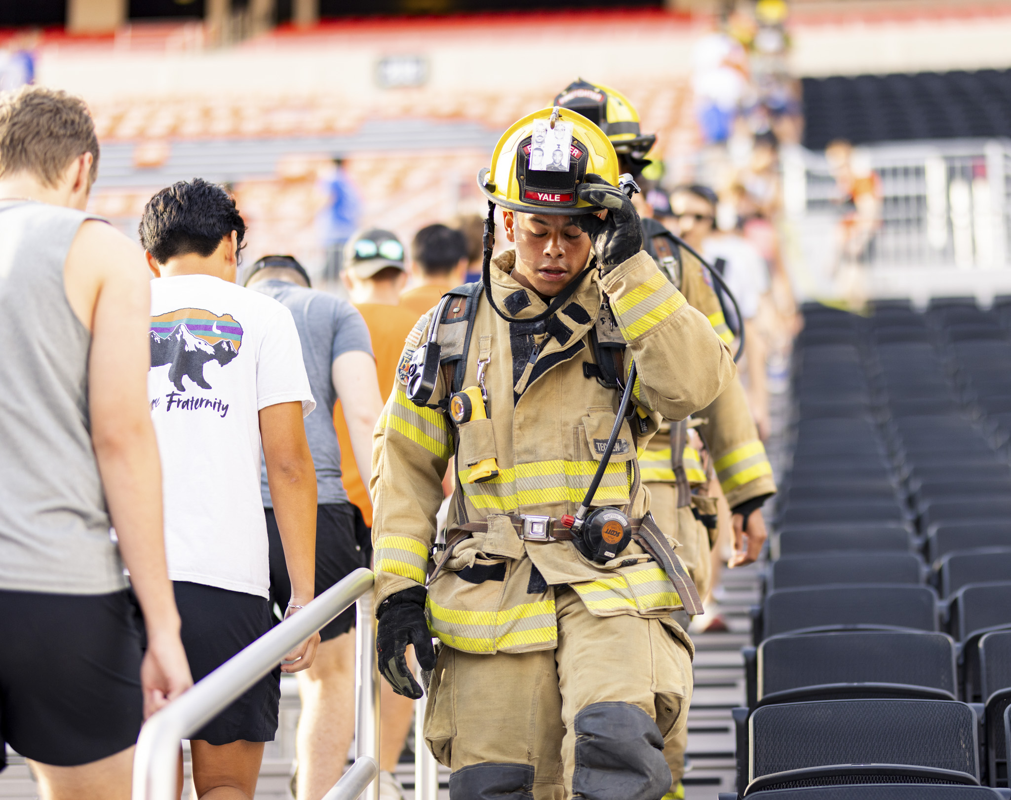 firefighter descending down the stadium steps