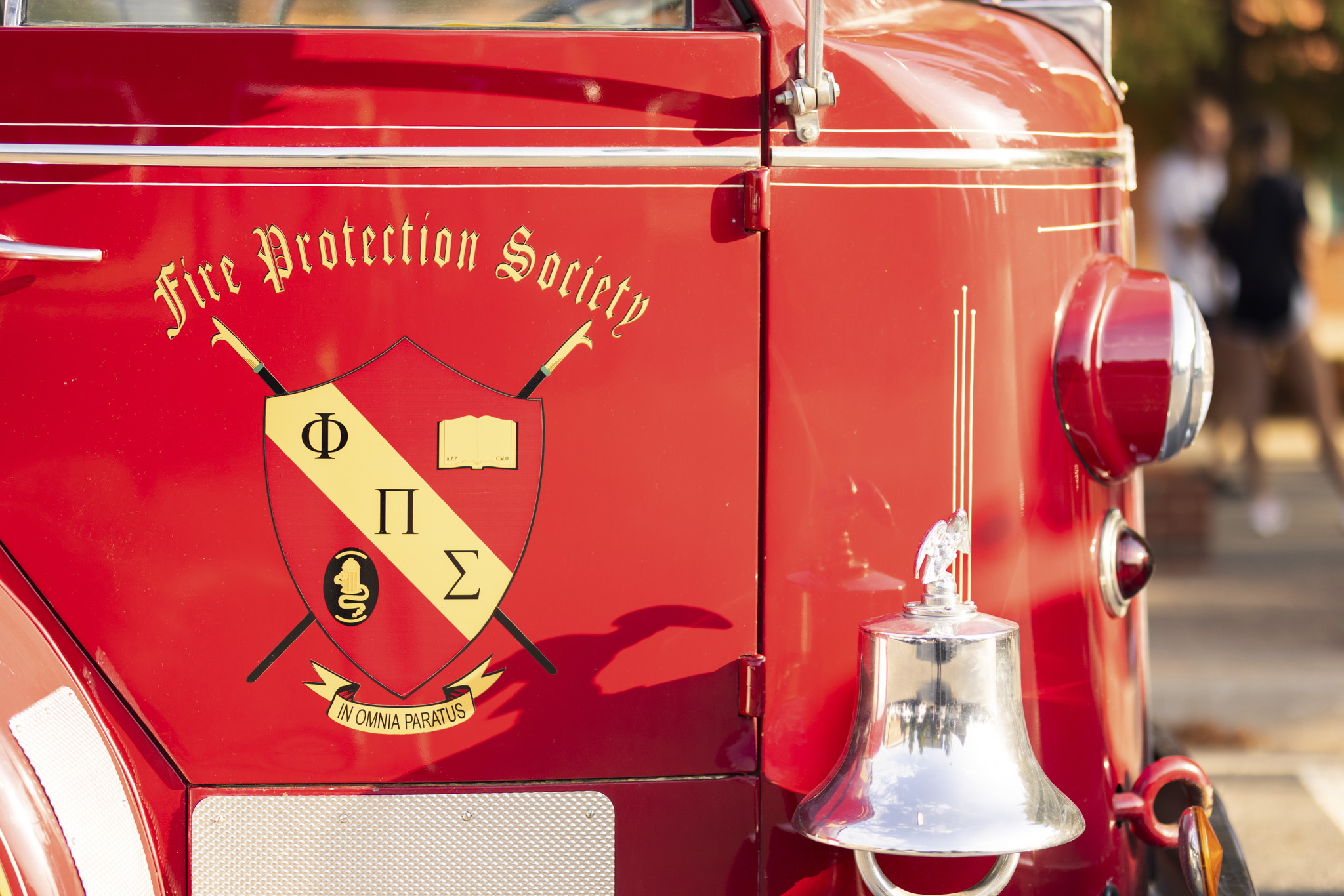 The Fire Protection Society emblem on the side of a firetruck