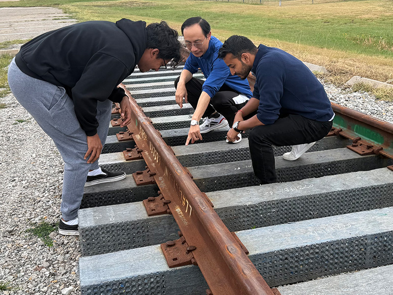 Dr. Joshua Li and his research team does an inspection of track defects and prepares for rail sensor development.