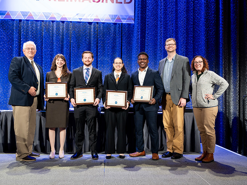 A group of award winners from OSU including Cory Campbell, Margaret Cook, Tylee Kareck and Keshawn Wallace, receive their awards from finishing first in the AIChE Student Design Contest