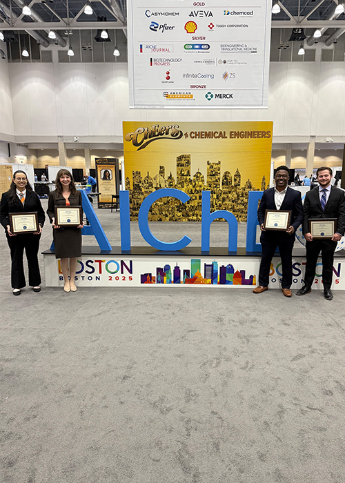 Cory Campbell, Margaret Cook, Tylee Kareck and Keshawn Wallace, all OSU CHE graduates, hold their awards from the AIChE Student Design contest