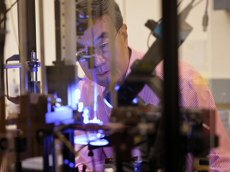 Dr. Weili Zhang working in his research lab