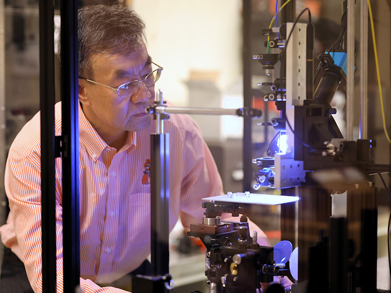 Dr. Weili Zhang conducts research in his lab