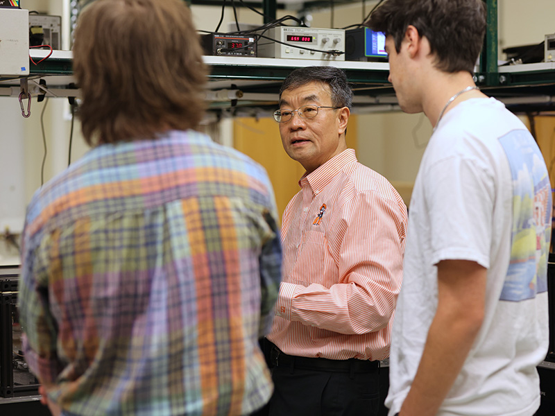 Dr. Weili Zhang mentors students in his research lab