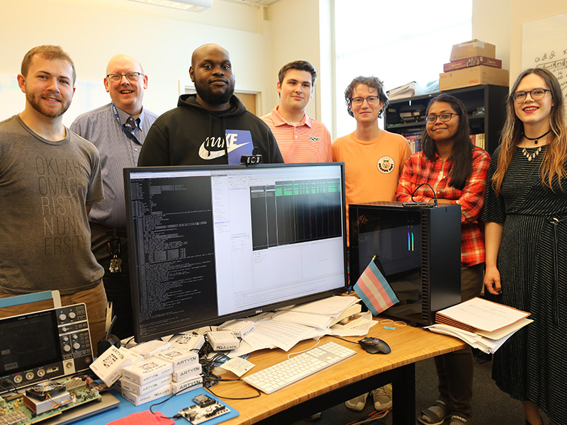 Dr. James Stine stands with a group of his students