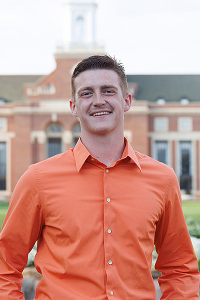 Joe Black, a student in the College of Engineering, Architecture and Technology, was named a Top 20 Freshmen for Oklahoma State University. He is pictured with the OSU library in the background.