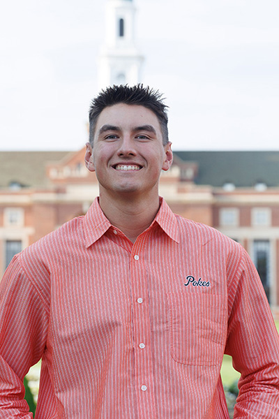 Myles Lozano, a student in the College of Engineering, Architecture and Technology, was named a Top 20 Freshmen for Oklahoma State University. He is pictured with the OSU library in the background.
