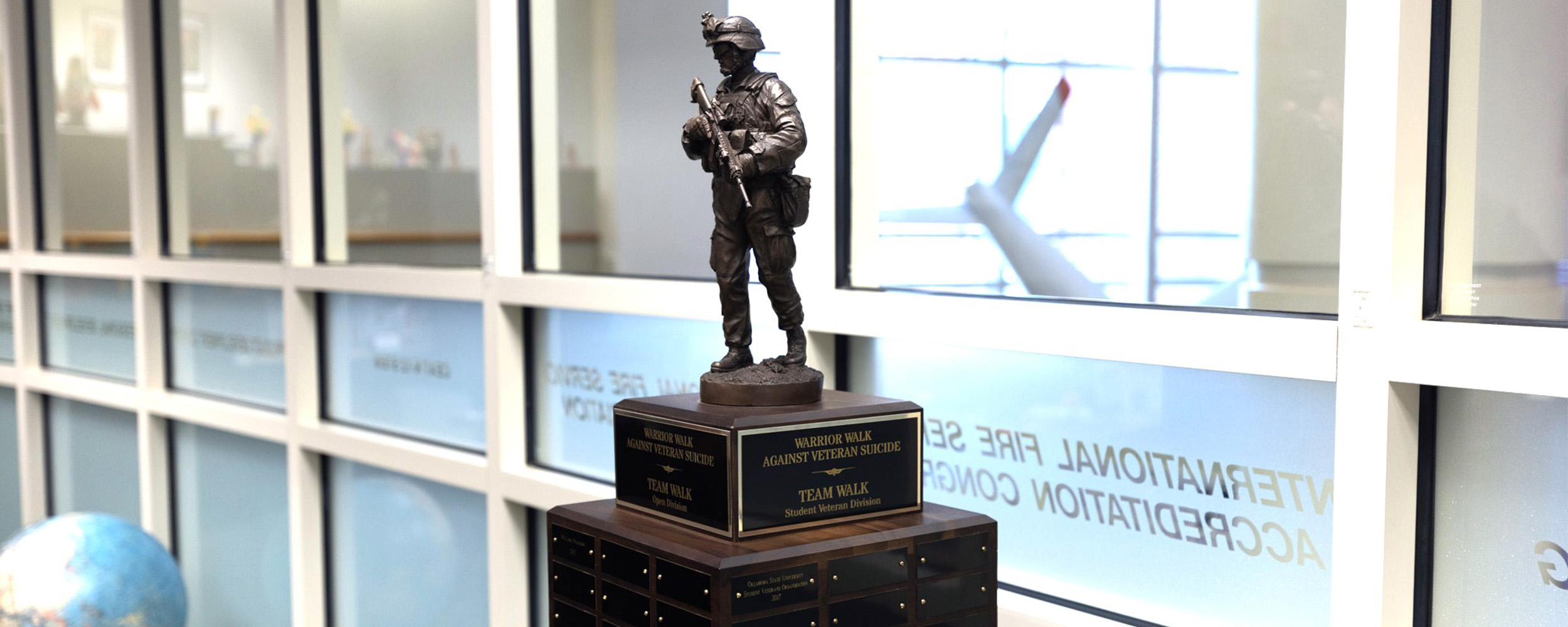Three Warrior Walk Against Veteran Suicide trophies refurbished into one trophy.