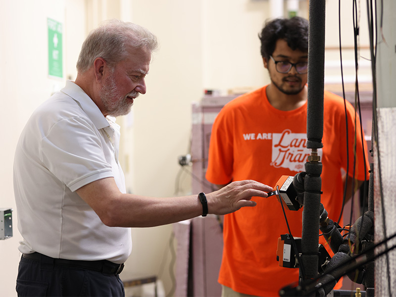 Dr. Jeffrey Spitler mentors a student in the Center for Integrated Building Systems lab