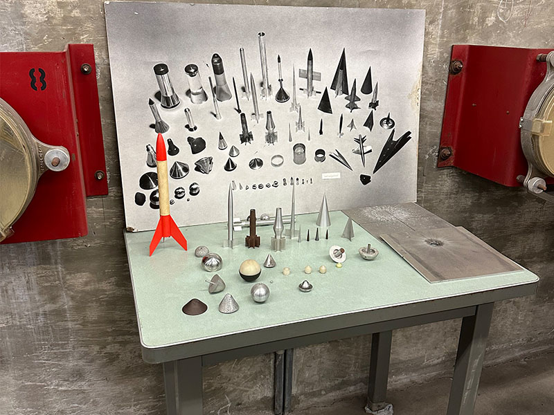 Images on display in a glass case from NASA.