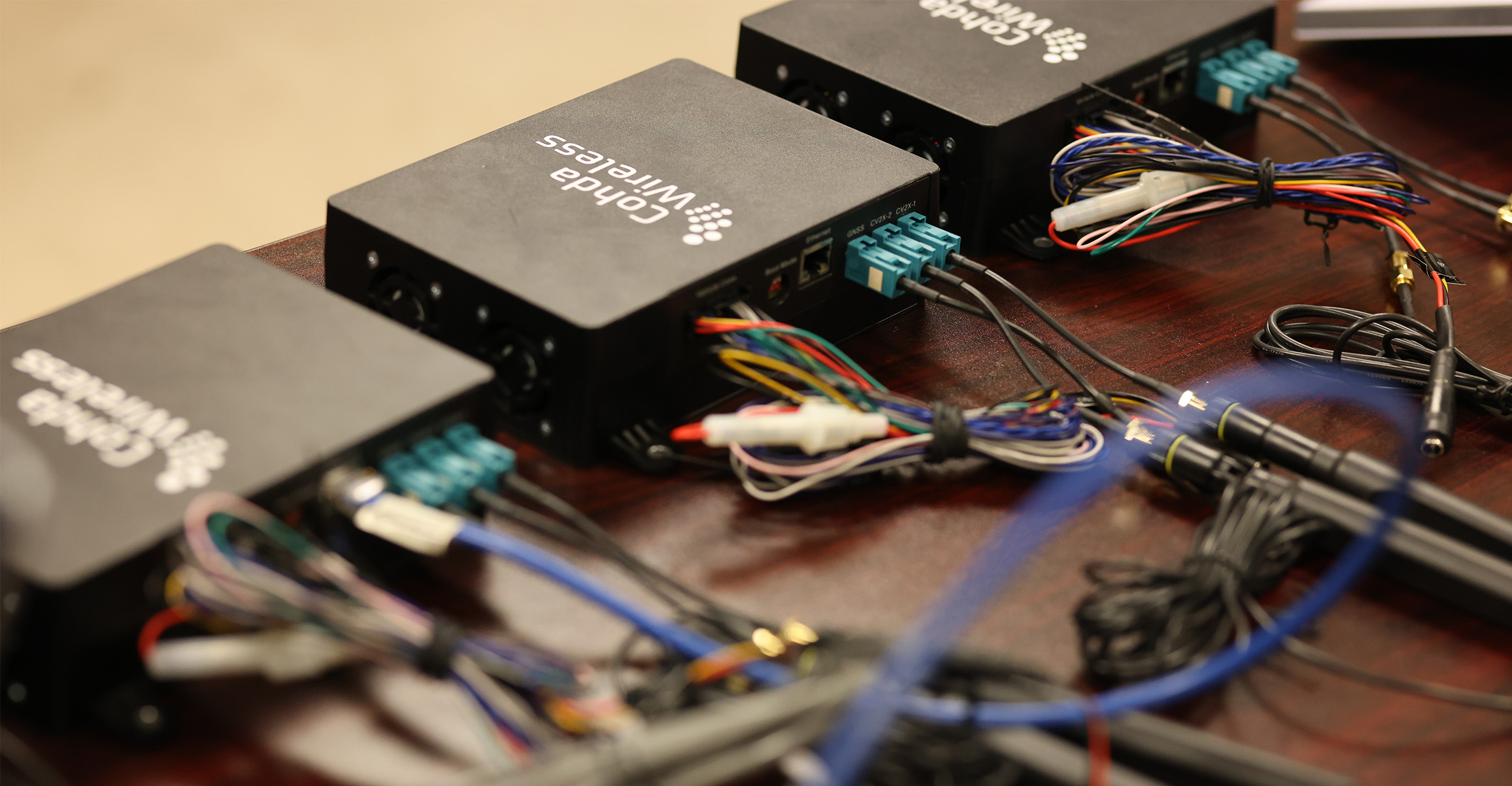 Electronic devices used to study autonomous vehicle communication sit on a desk in the laboratory of Dr. Joshua Li, an associate professor in the School of Civil and Environmental Engineering.