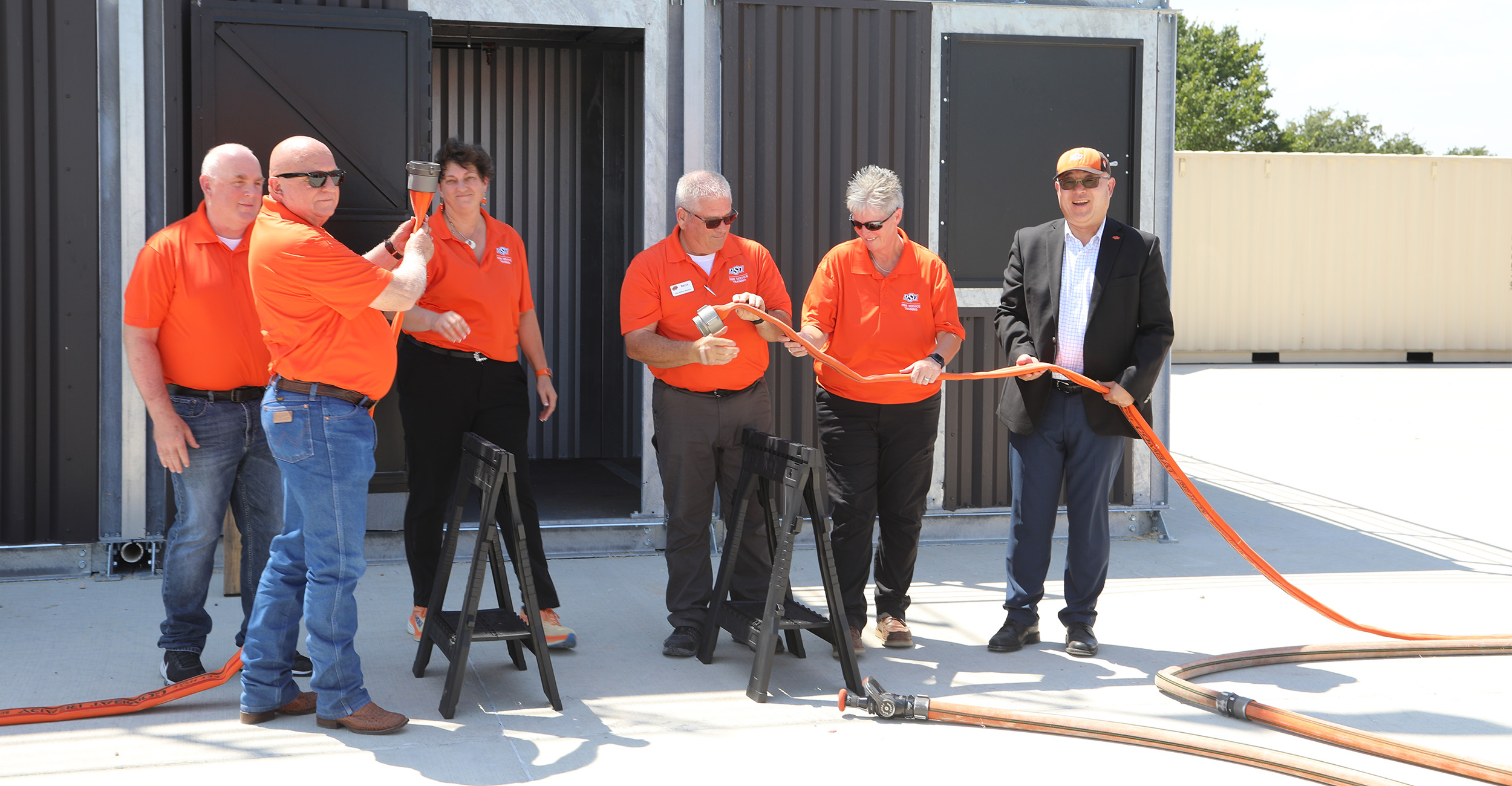 Members of the leadership of OSU Fire Safety Training pose during an uncoupling ceremony.