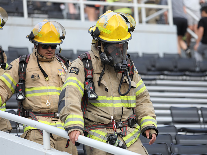 A man in his full firefighter gear walks the steps of Boone Pickens Stadium during the eighth annual 9/11 Memorial Stair Climb.