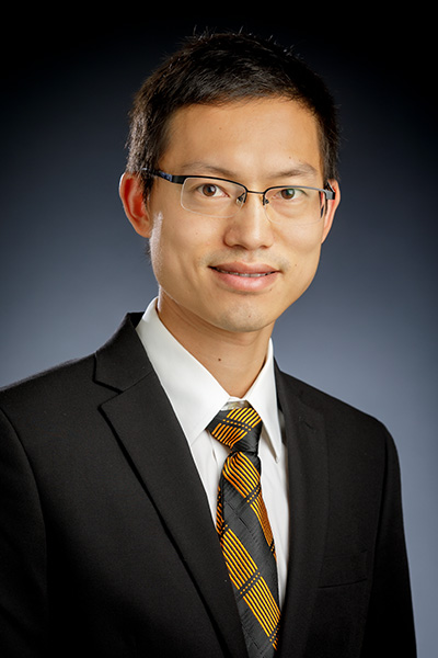 Dr. Shuodao Wang is shown wearing a suit and tie for a staff portrait.