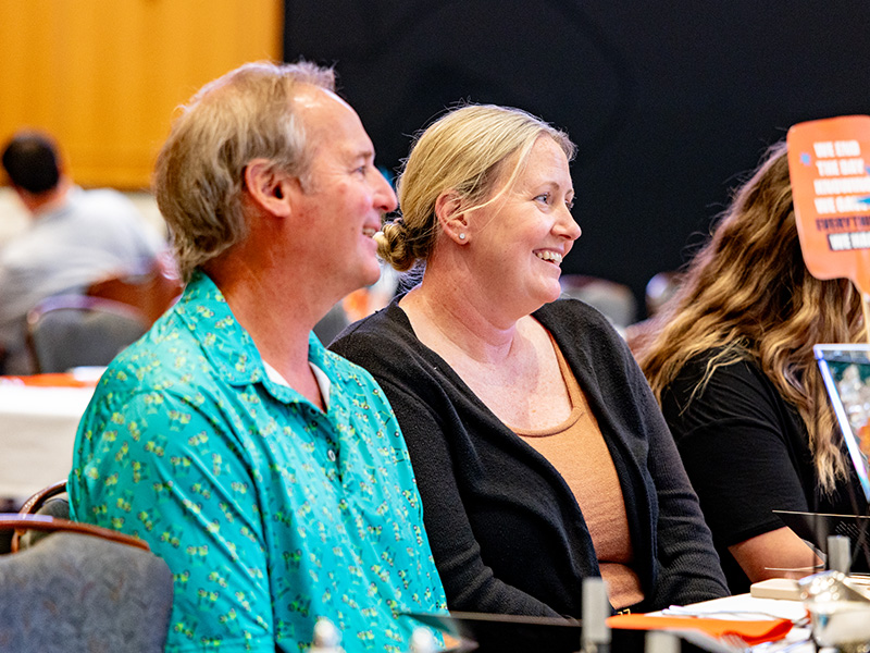Attendees sit side by side at a table during a CEAT Faculty, Staff, and Student Awards Banquet, with event materials and table settings visible in a formal indoor dining setting.