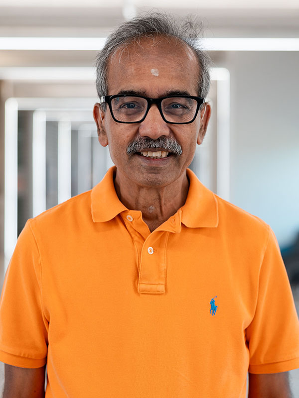 A man poses for a professional headshot.