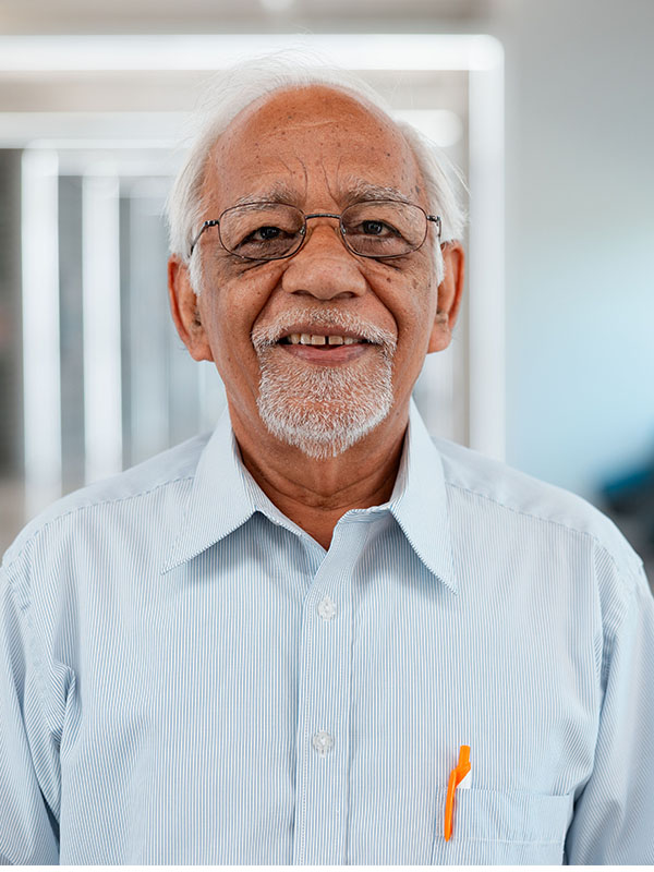 A man poses for a professional headshot.