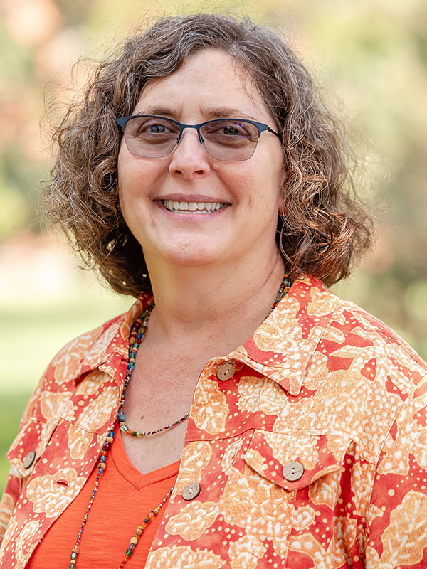 A woman poses for a professional headshot.
